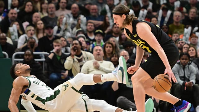 Utah Jazz forward Kelly Olynyk (41) and Milwaukee Bucks forward Giannis Antetokounmpo (34) 